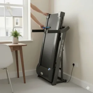 Compact foldable treadmill tucked away in a British spare room to demonstrate space-saving value.