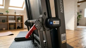 A high-resolution photorealistic photograph of a compact, budget-friendly folding treadmill, compatible with Kinomap, standing in a small London flat's spare room.