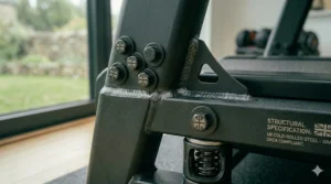Detailed view of the structural specification label on a UKCA-compliant treadmill, confirming the use of heavy duty UK cold-rolled steel.