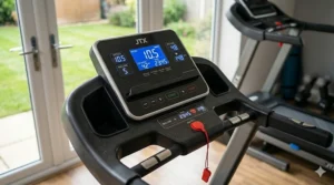Digital console of an affordable treadmill displaying speed in kilometres and heart rate monitor.