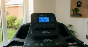 Close-up of the Domyos Run 100 LCD console showing integrated workout metrics including speed, time, and calories.
