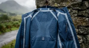 Back view of a breathable running shell showing laser-cut ventilation panels for temperature control.
