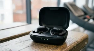 A sleek, compact wireless earbuds charging case, ideal for carrying in a UK gym kit bag.