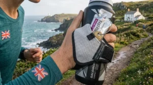 Handheld water bottle featuring a small pocket for storing running gels and keys.