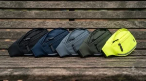 Flat-lay of various colour options for affordable running bum bags under 30 pounds