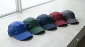 A selection of vibrant colour options for a running cap under £15 displayed flat on a surface.