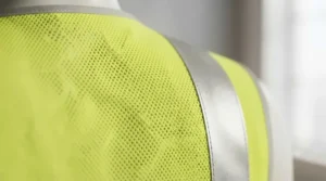 Breathable mesh fabric on a low-cost high-visibility vest suitable for all-weather outdoor workouts.