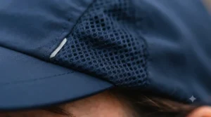 Close-up of lightweight, moisture-wicking mesh fabric on a budget running cap under £15.