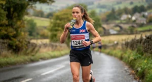 UK marathon runner consuming a Precision Hydration electrolyte fuel during a long training run.