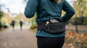 Runner testing the capacity of a comfortable, cheap running bum bag on a trail run