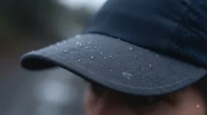 Water-resistant peak on a running cap under £15 protecting against unexpected British showers.