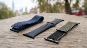 Breathable sport loop and fluoroelastomer Apple Watch bands laid out on a trainer.