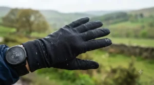 Close-up of breathable, moisture-wicking fabric on a pair of lightweight running gloves for spring.