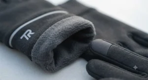 Interior lining and breathable fabric detail of fleece-lined touchscreen running gloves.