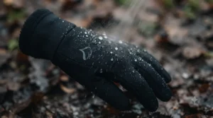 Water-resistant winter running gloves shedding light rain during a drizzle in Britain.