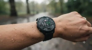A durable, water-resistant Garmin running watch worn on a wrist during a typical British drizzle.